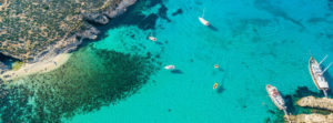 Blue Lagoon Malta seen from above with turquoise water
