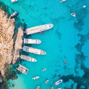 Ferries, sliema to get to Comino Blue lagoon, drone shot