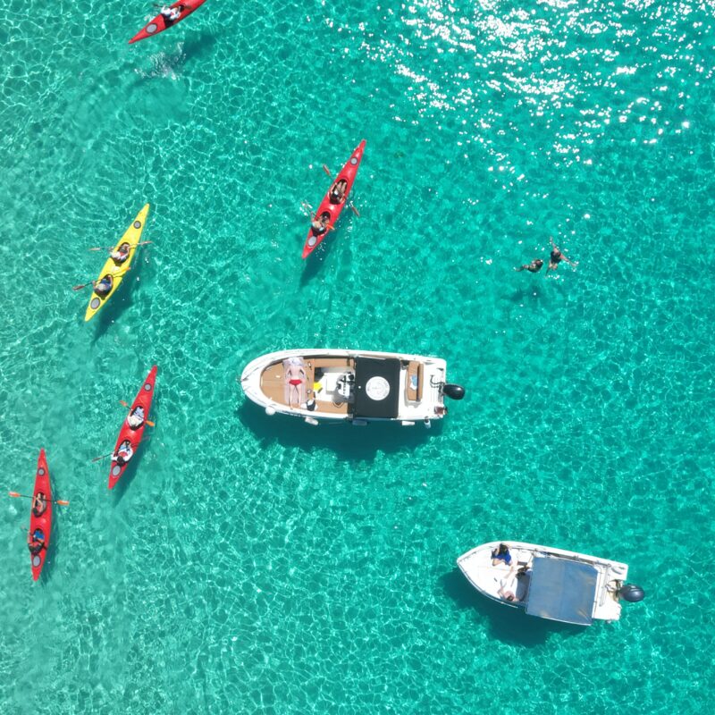 Boat at anchor and Kayaks outdoor explorers malta