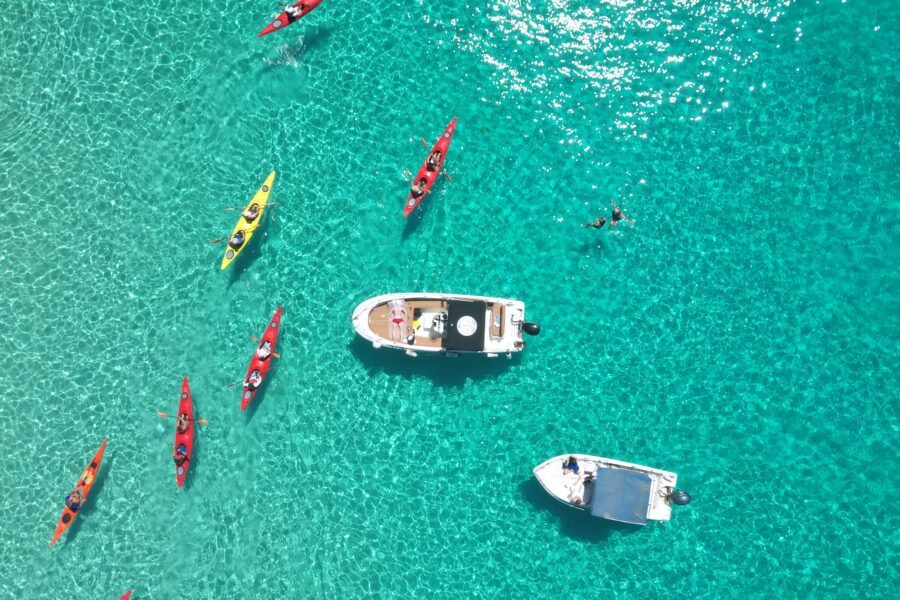 Boat at anchor and Kayaks outdoor explorers malta