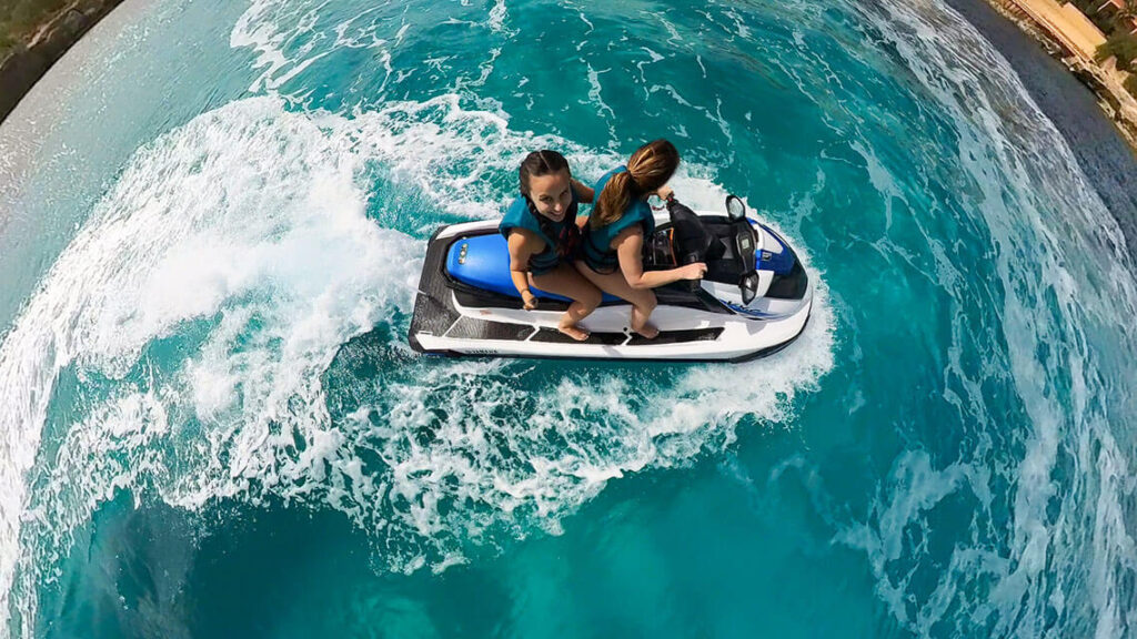 Two riders enjoy a jet ski rental in Malta, exploring crystal-clear waters and scenic coastlines on an exciting adventure.