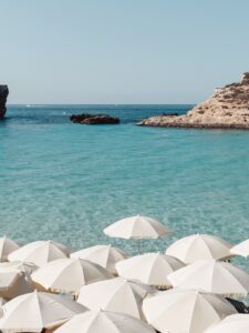 Blue Lagoon Comino early morning with calm blue water and no crowds, showing peaceful conditions before daytime boat traffic arrives.