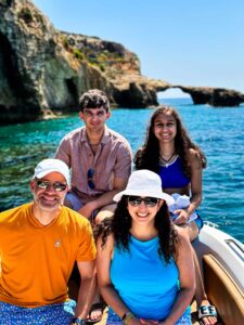Family enjoying time on a private boat in Malta, relaxing together on calm blue water during a comfortable and family-friendly boat tour.