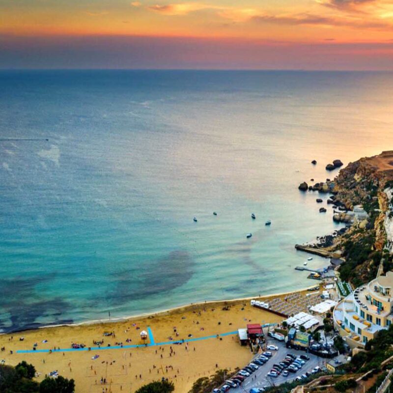 golden bay malta sunset sandy beach orange sky sea view