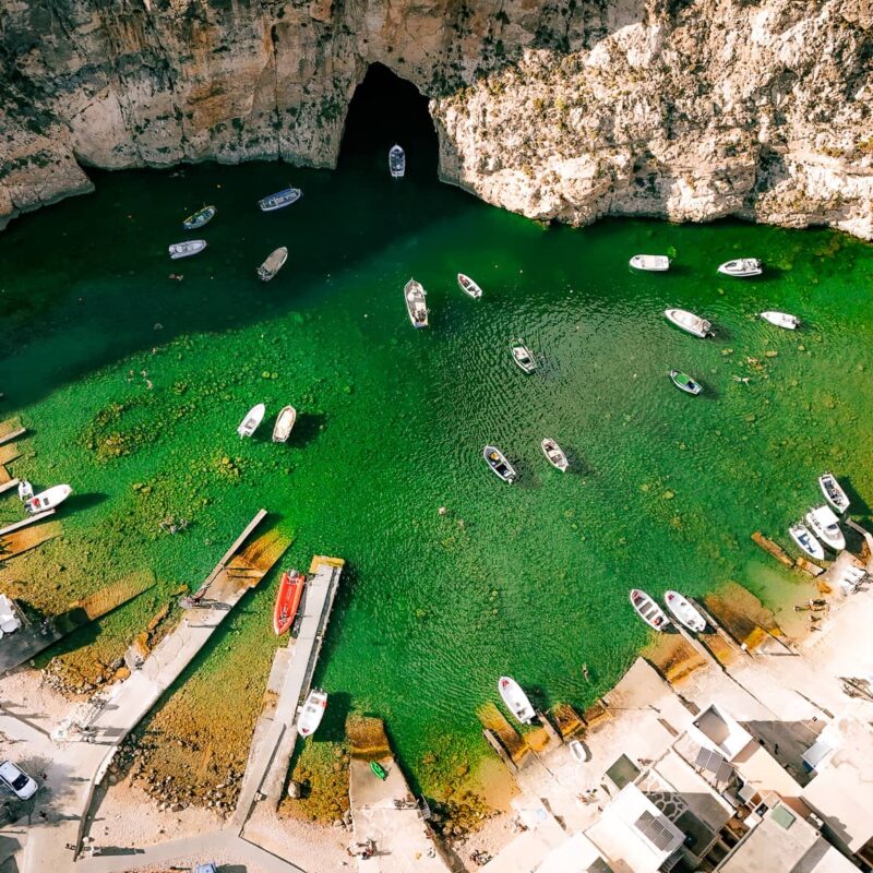 inland sea dwejra bay gozo malta lagoon tunnel crystal clear water cliffs boat ride scenic