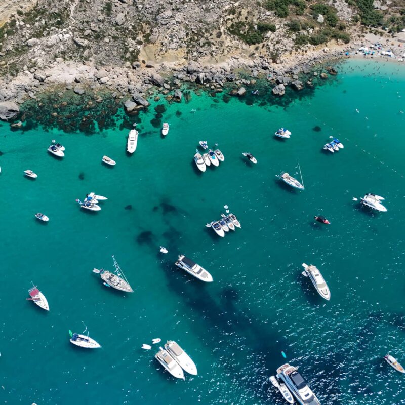 private boat anchored paradise bay malta turquoise water peaceful bay