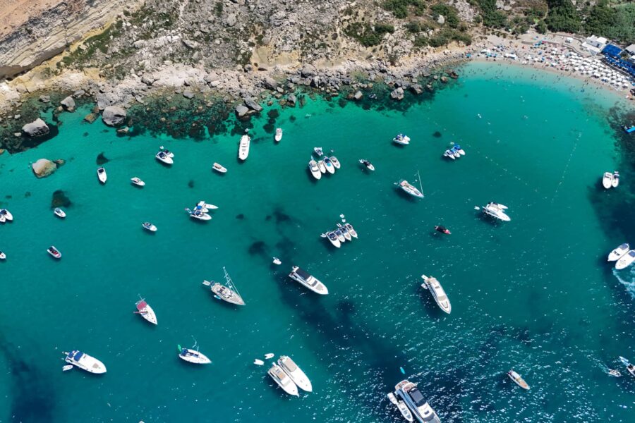private boat anchored paradise bay malta turquoise water peaceful bay