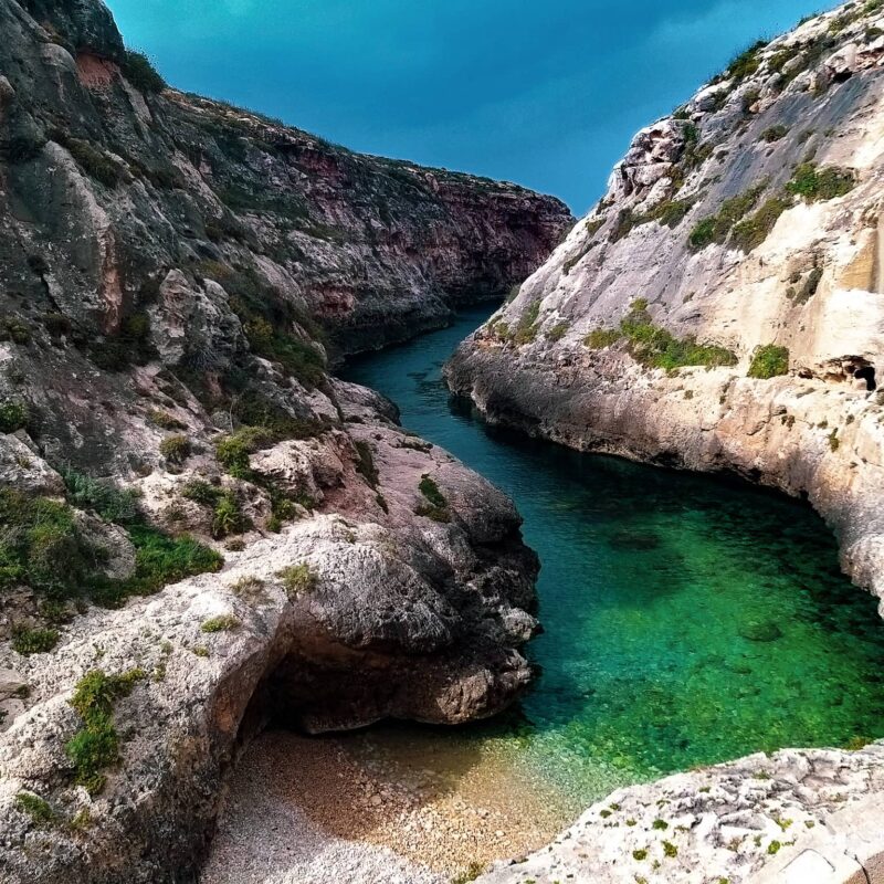 wied il ghasri gozo malta narrow valley crystal clear water hidden beach cliffs scenic coastline
