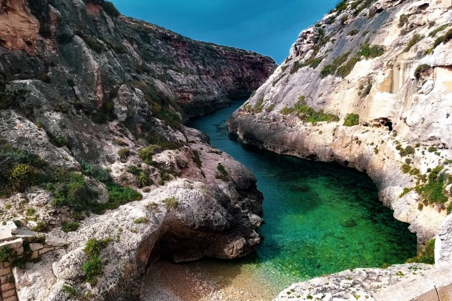 wied il ghasri gozo malta narrow valley crystal clear water hidden beach cliffs scenic coastline