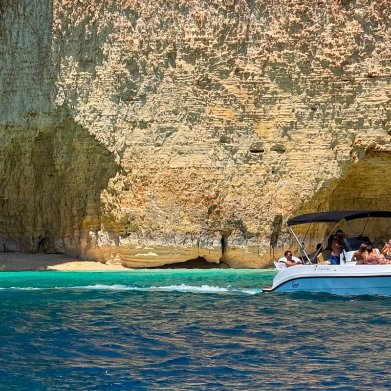Outdoor Explorers Malta private boat near Secret Beach Comino with clear blue water and white sand
